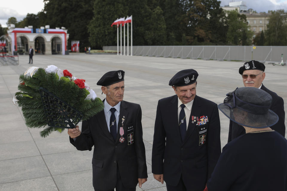 Members of Polish Army Veterans Association attend a wreath laying ceremony marking national observances of the anniversary of World War II in Warsaw, Poland, Sept. 1, 2022. World War II began on Sept. 1, 1939, with Nazi Germany's bombing and invading Poland, for more than five years of brutal occupation. (AP Photo/Michal Dyjuk)