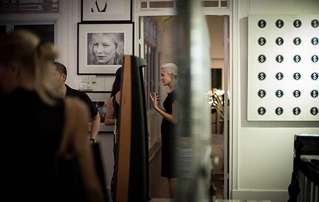 Guests talking at Dominic Khoo's art showcase, which also includes works by local talent Skl0. (Andrew Lum Photography)