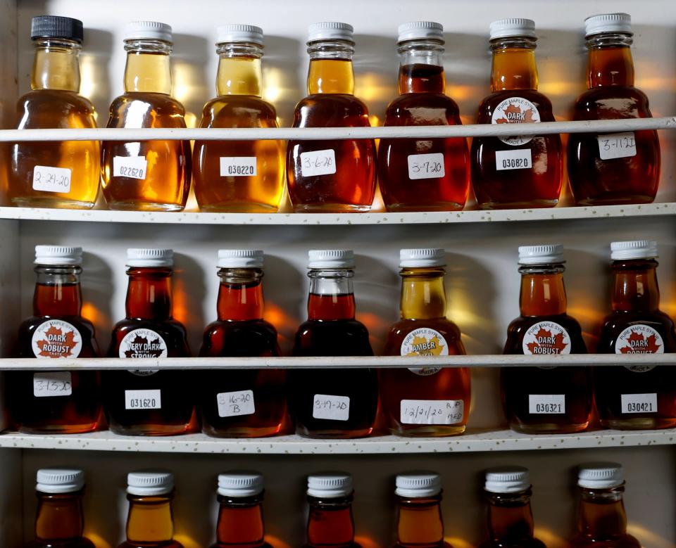 A variety of maple syrup samples with the colors and varieties of syrup produced based on weather conditions when sap is collected sit on a shelf inside Haig''s Sugar House Farm in Bellevue on Thursday, Feb. 22, 2024. From Golden Delicate to Amber Rich and Dark Robust, each color produces a different maple syrup taste.