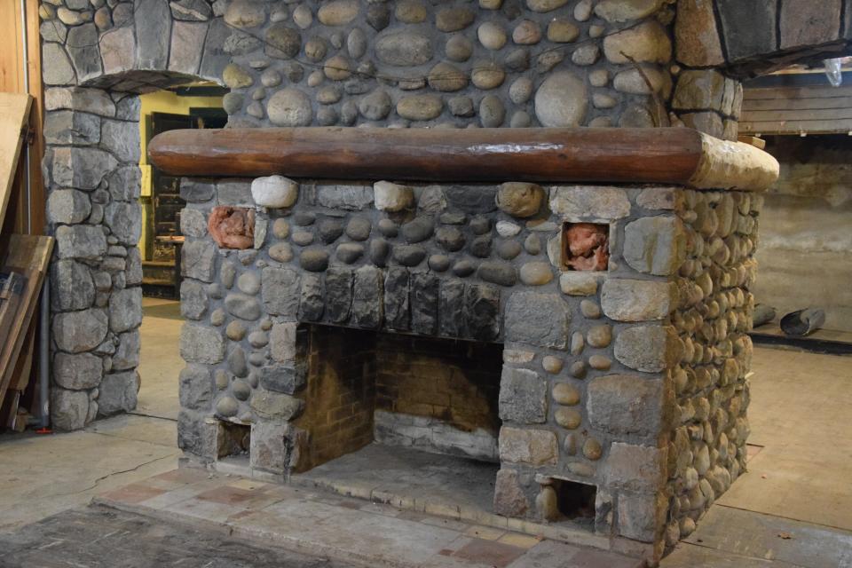 A double sided fireplace sits in the basement that once housed Slim's Speakeasy.