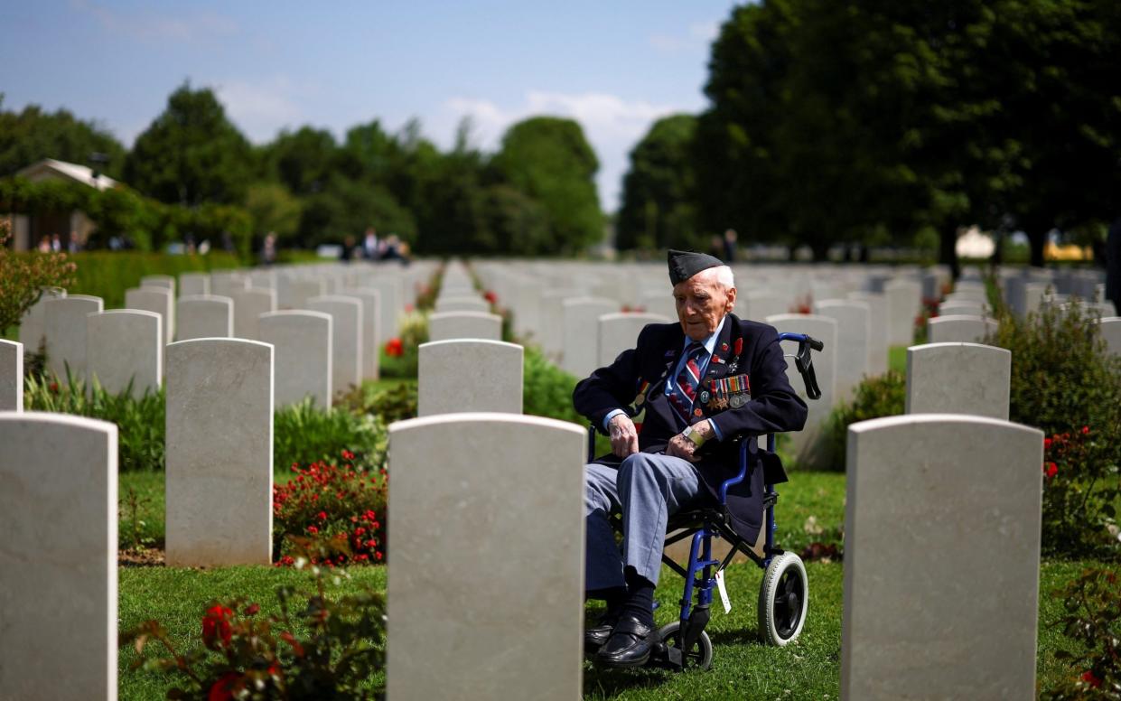 British veteran Bernard Morgan, 100, looks on at Bayeux cemetery