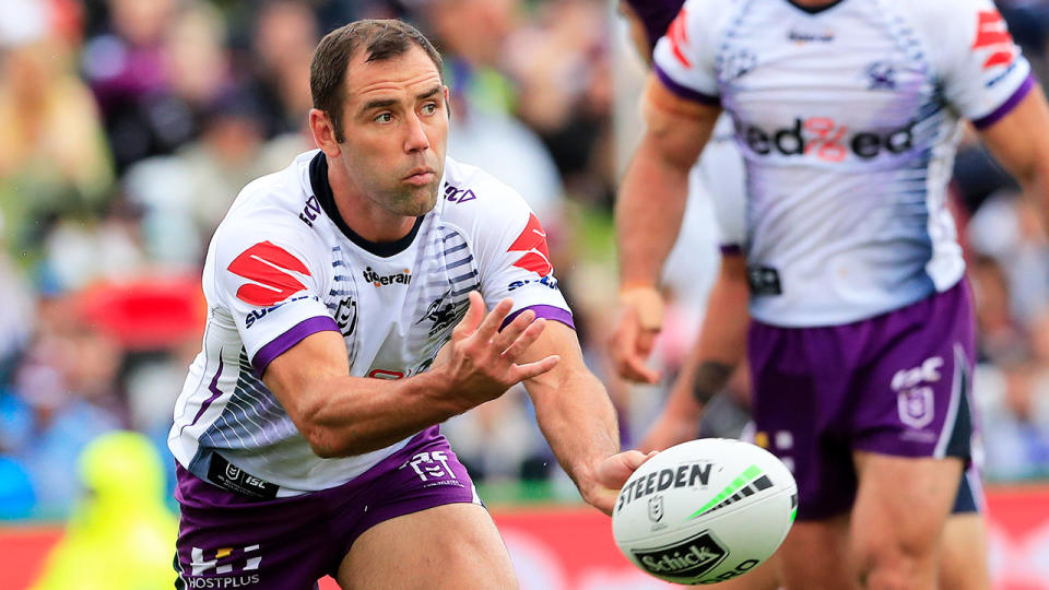 Cam Smith is seen passing a ball from dummy half during a Melbourne Storm game.