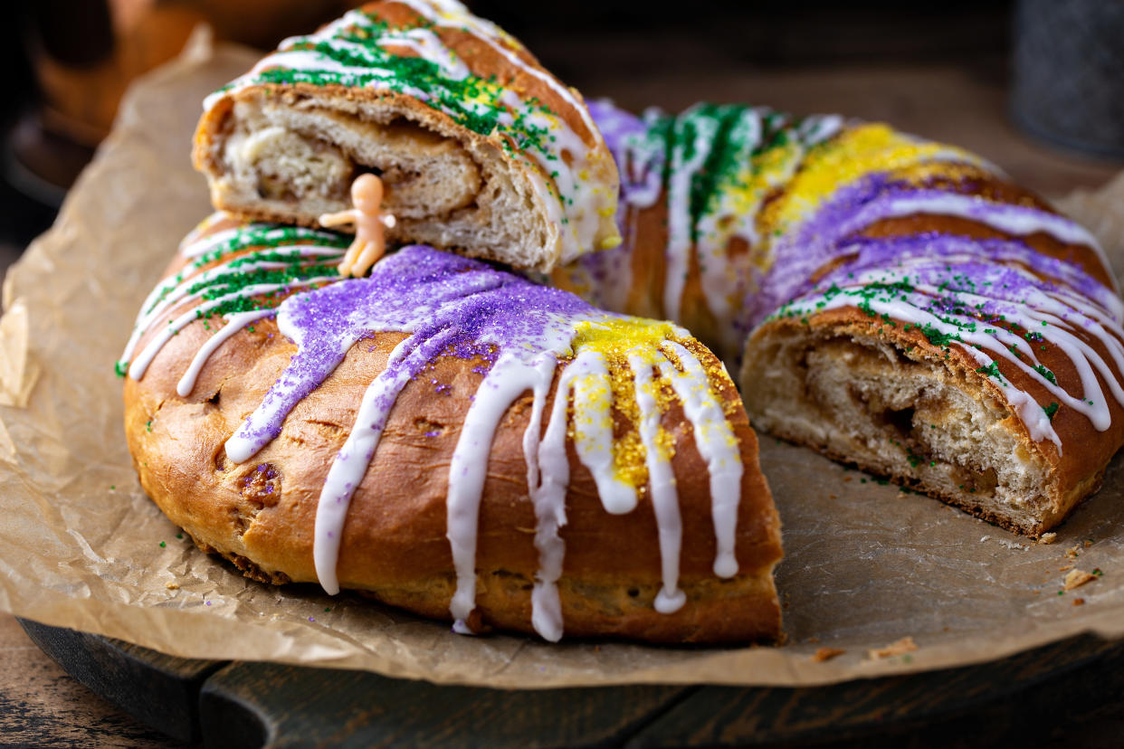 Plastic baby aside, eating a colorful king cake for Mardi Gras is a cinnamon-sugary tradition. (Photo: Getty Creative)Plastic baby aside, eating a colorful king cake for Mardi Gras is a cinnamon-sugary tradition. (Photo: Getty Creative)