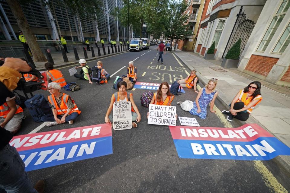 Protesters from Insulate Britain block a road outside the Home Office in central London (Yui Mok/PA) (PA Wire)