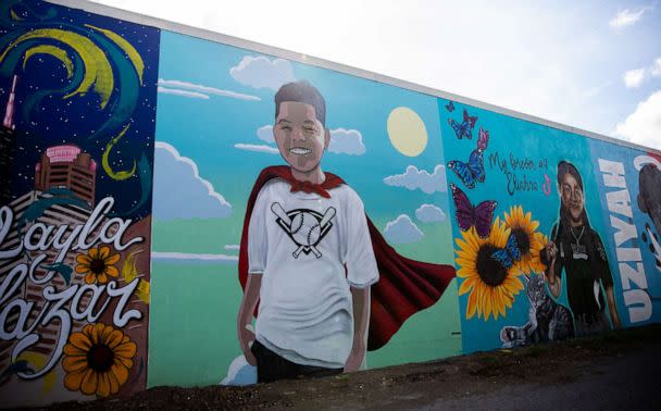 PHOTO: A mural in honor of Jose Manuel Flores Jr. (wearing the cape), along with other children lost in the Robb Elementary school shooting, decorate the wall of a building in downtown Uvalde, Texas, Aug. 21, 2022. (Kat Caulderwood/ABC News)