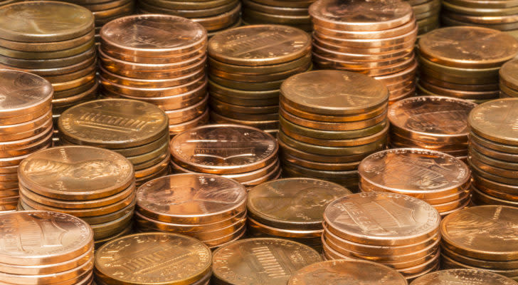 Stacks of pennies sitting around each other representing Exela Technologies XELA stock.