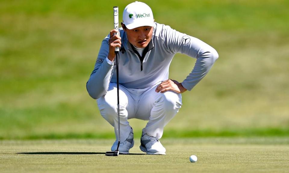 Li Haotong lines up a putt on the 13th green during the second round of the US PGA Championship.