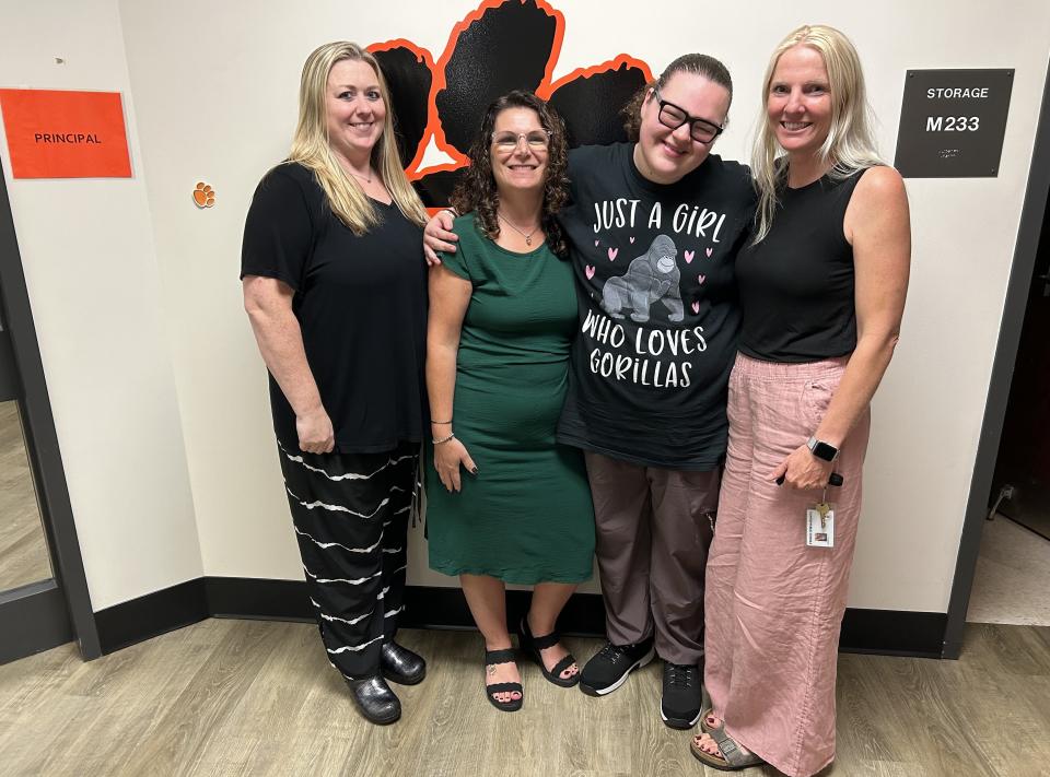 Taunton High School senior Madelyn Tokarz (third from left) described her success in achieving a National Honor Society membership with (left to right) Taunton High culinary teacher Sarah Gibson, Special Education Coordinator Kimberly Moreton, and special education science teacher Elisabeth Comerford on Sept. 13.