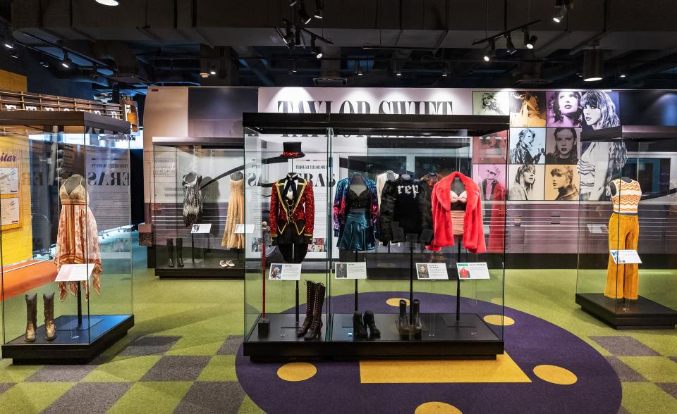 Numerous Taylor Swift costumes are on display at the Country Music Hall of Fame and Museum