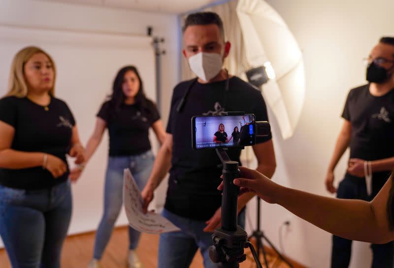 Relatives of Granados Sanchez rehearse for a virtual raffle to raise funds in Queretaro