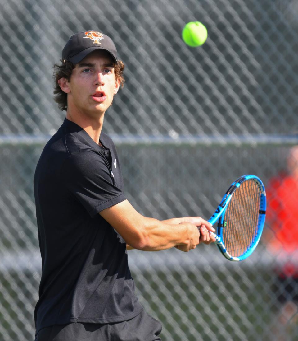 Gavin Fenstad concentrates on the ball during his match against Monticello Wednesday, May 18, 2022, at Tech High School.