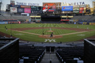 The stadium is almost totally empty during the second inning of a baseball game between the New York Yankees and the Boston Red Sox at Yankee Stadium, Friday, July 31, 2020, in New York. (AP Photo/Seth Wenig)