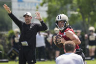 New Orleans Saints quarterback Derek Carr runs through drills during NFL football practice in Metairie, La., Tuesday, May 21, 2024. (AP Photo/Gerald Herbert)