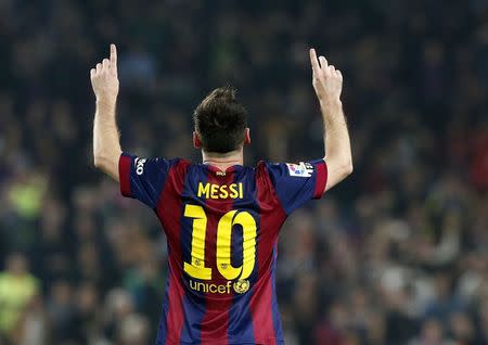 Barcelona's Lionel Messi celebrates his goal against Sevilla during their Spanish first division soccer match at Nou Camp stadium in Barcelona November 22, 2014. REUTERS/Gustau Nacarino