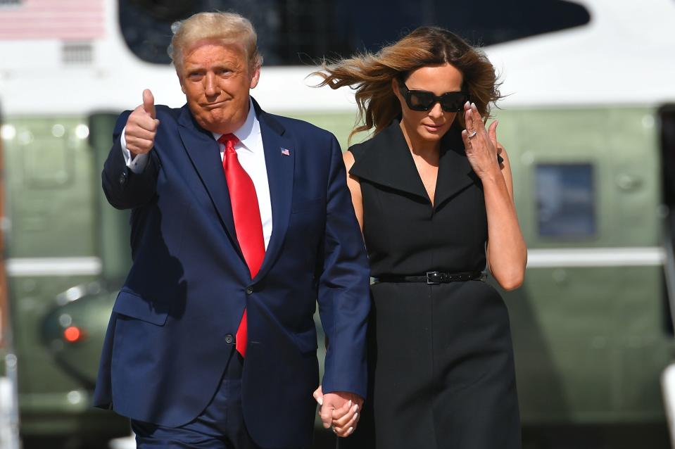 US President Donald Trump and First Lady Melania Trump arrive to board Air Force One at Joint Base Andrews in Maryland on October 22, 2020. - President Trump travels to Nashville, Tennessee, for the final presidential debate. (Photo by MANDEL NGAN / AFP) (Photo by MANDEL NGAN/AFP via Getty Images)