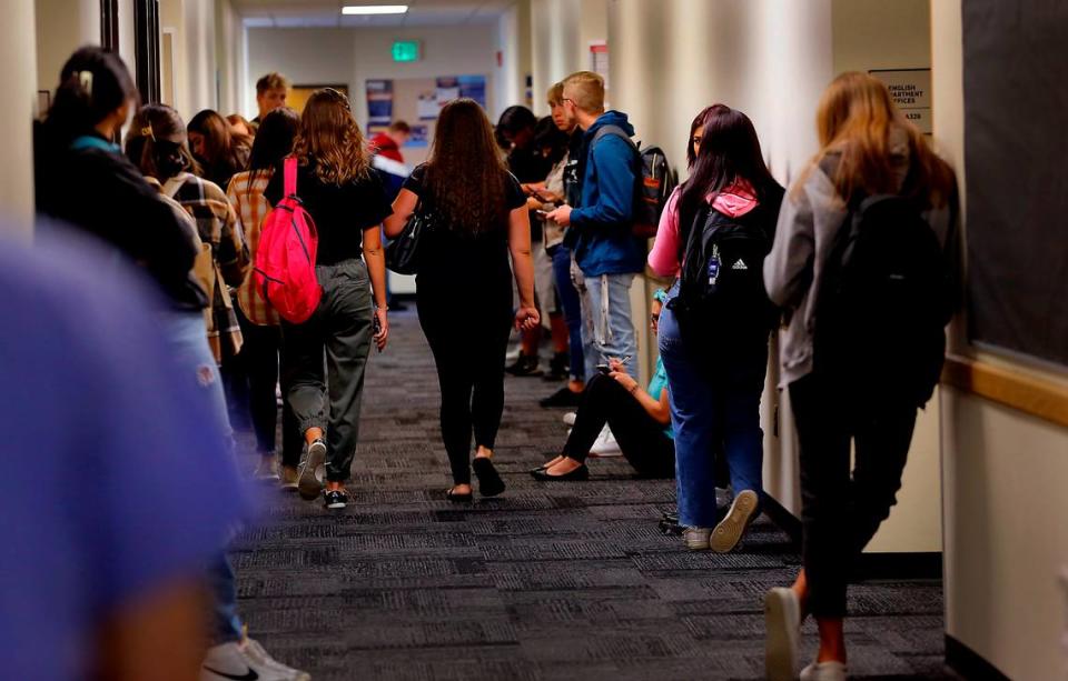 Students at the Columbia Basin College campus in Pasco wait in the English department hallway for their classrooms to open on the first day in this 2022 file photo.