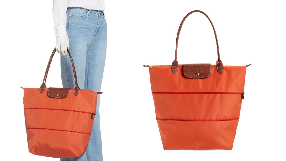 The zipper allows you to customize the size of this Longchamp tote.