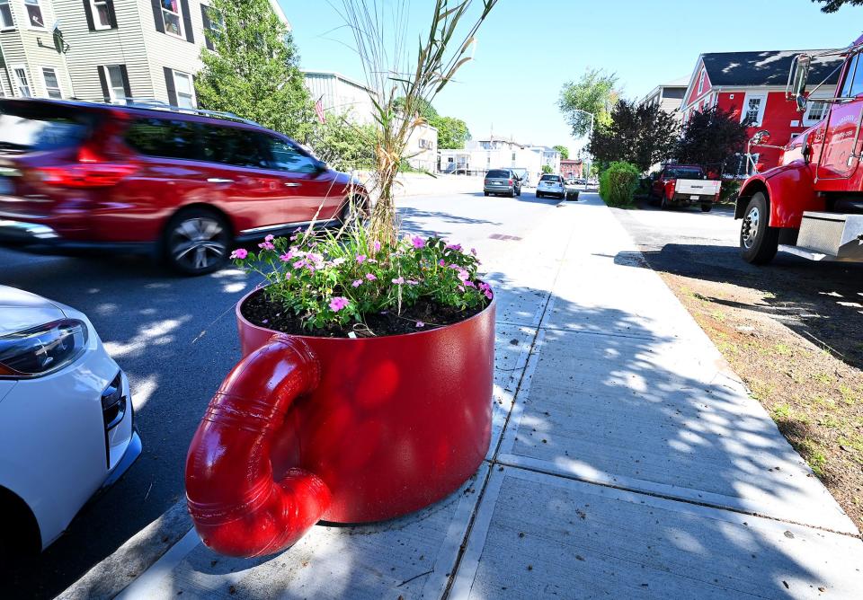 Arthur Mooradian of Mooradian Real Estate designed two giant coffee mug planters from metal pipes, currently on Piedmont Street, for Preservation Worcester.