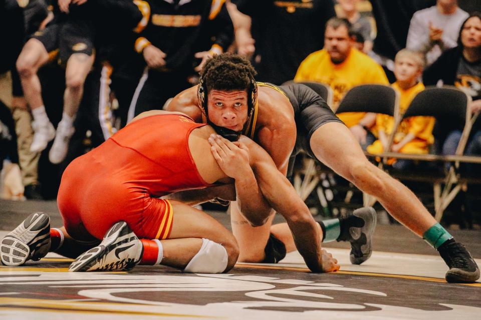 Missouri redshirt sophomore and Hickman alum Jeremiah Kent glances over during the 184-pound match in the Tigers' 17-16 loss to No. 5 Iowa State on Wednesday. Kent bear-hugged his opponent, his signature move, and electrified the Hearnes Center.