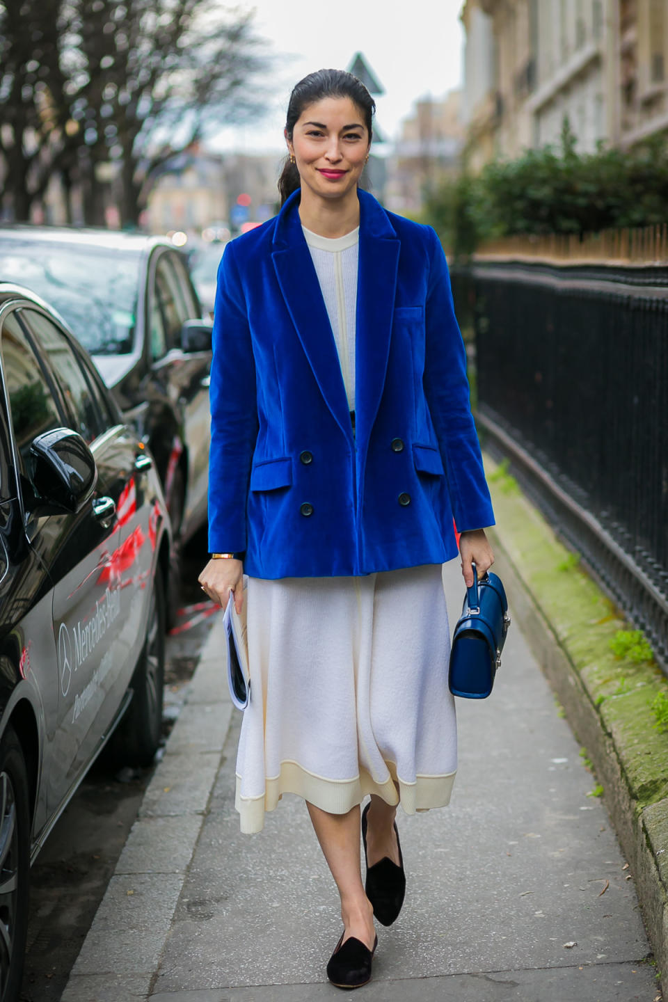 Caroline Issa does simple and ladylike to perfection with her cream-colored dress, velvet coat, and matching bag.