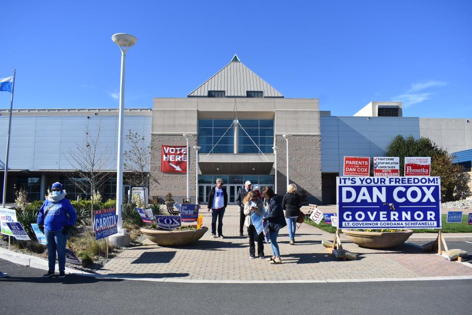 Voters congregate outside of the Roland E. Powell Convention Center in Ocean City, Md., on Tuesday, November 8.