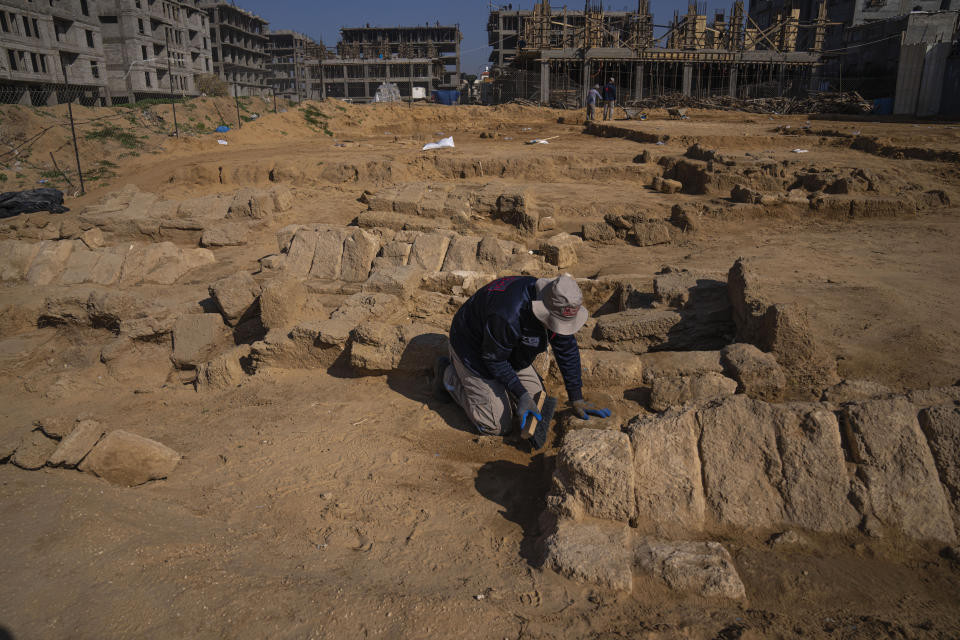 A Palestinian excavation team works in a newly discovered Roman era cemetery in the Gaza Strip, Sunday, Dec. 11, 2022. Hamas authorities in Gaza announced the discovery of over 60 tombs in the ancient burial site. Work crews have been excavating the site since it was discovered last January during preparations for an Egyptian-funded housing project. (AP Photo/Fatima Shbair)