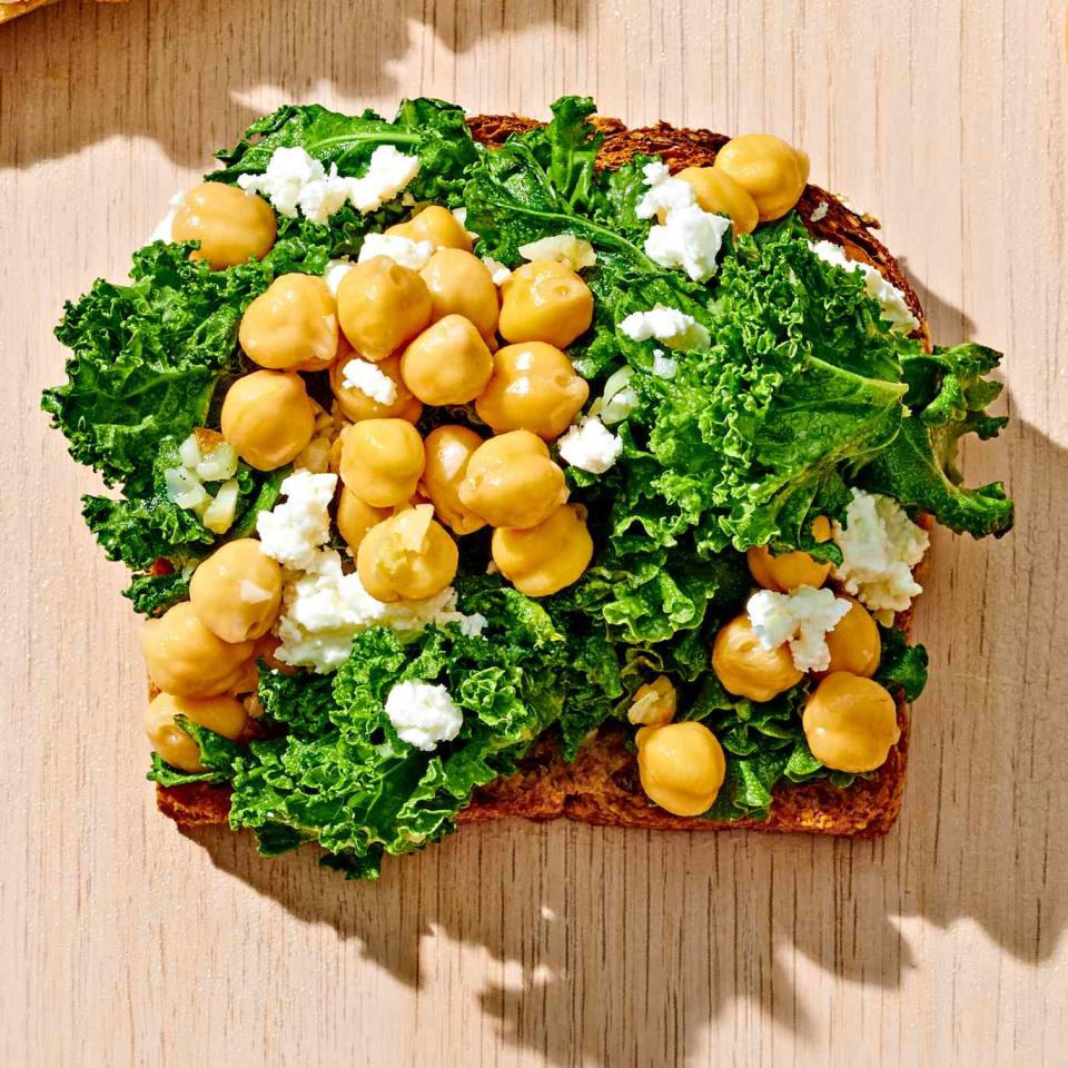 <p>This healthy toast recipe combines chickpeas, kale and feta for a savory bite. <a href="https://www.eatingwell.com/recipe/7920657/chickpea-kale-toast/" rel="nofollow noopener" target="_blank" data-ylk="slk:View Recipe" class="link ">View Recipe</a></p>