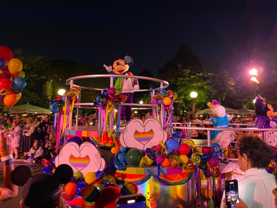 mickey on rainbow pride float at pride cavalcade