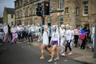 <p>Students from St Andrews University indulge in a tradition of covering themselves with foam to honor the “academic family” on Lower College Lawn on Oct. 23, 2017, in St Andrews, Scotland. (Photo: Jeff J Mitchell/Getty Images) </p>