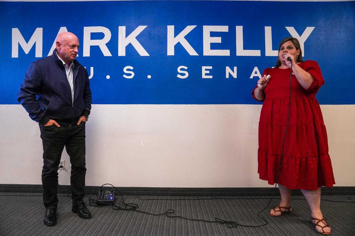 Arizona Democratic Party Chairwoman Raquel Teran, right, introduces Sen. Mark Kelly during an opening event for the first Mission for Arizona Coordinated Campaign office in Mesa on Thursday, April 14, 2022.