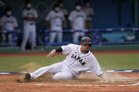 Japan's Hideto Asamura scores on a fielder's choice after Munetaka Murakami hit a ground ball during the seventh inning of a baseball game against the Dominican Republic at the 2020 Summer Olympics, Wednesday, July 28, 2021, in Fukushima, Japan. (AP Photo/Jae C. Hong)