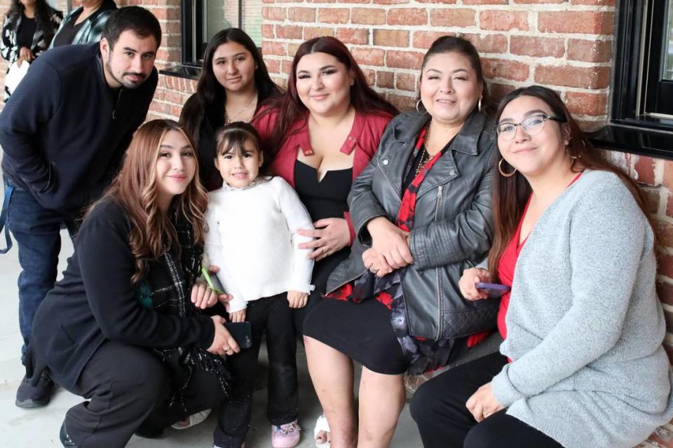 Rosa Barriga (second from right) and her four adult daughters waited for her husband Gonzalo Barriga who also became a naturalized citizen on Dec. 20, 2023 in Fresno.