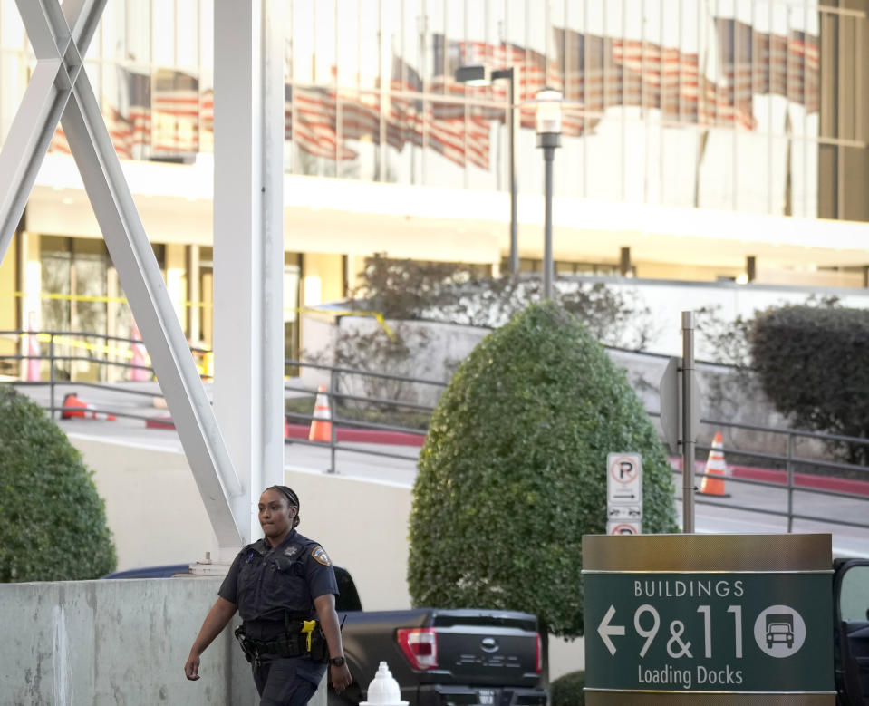 A Houston Police officer outside of Lakewood Church after a reported shooting during a church service in Houston, Sunday, Feb. 11, 2024. (Karen Warren/Houston Chronicle via AP)