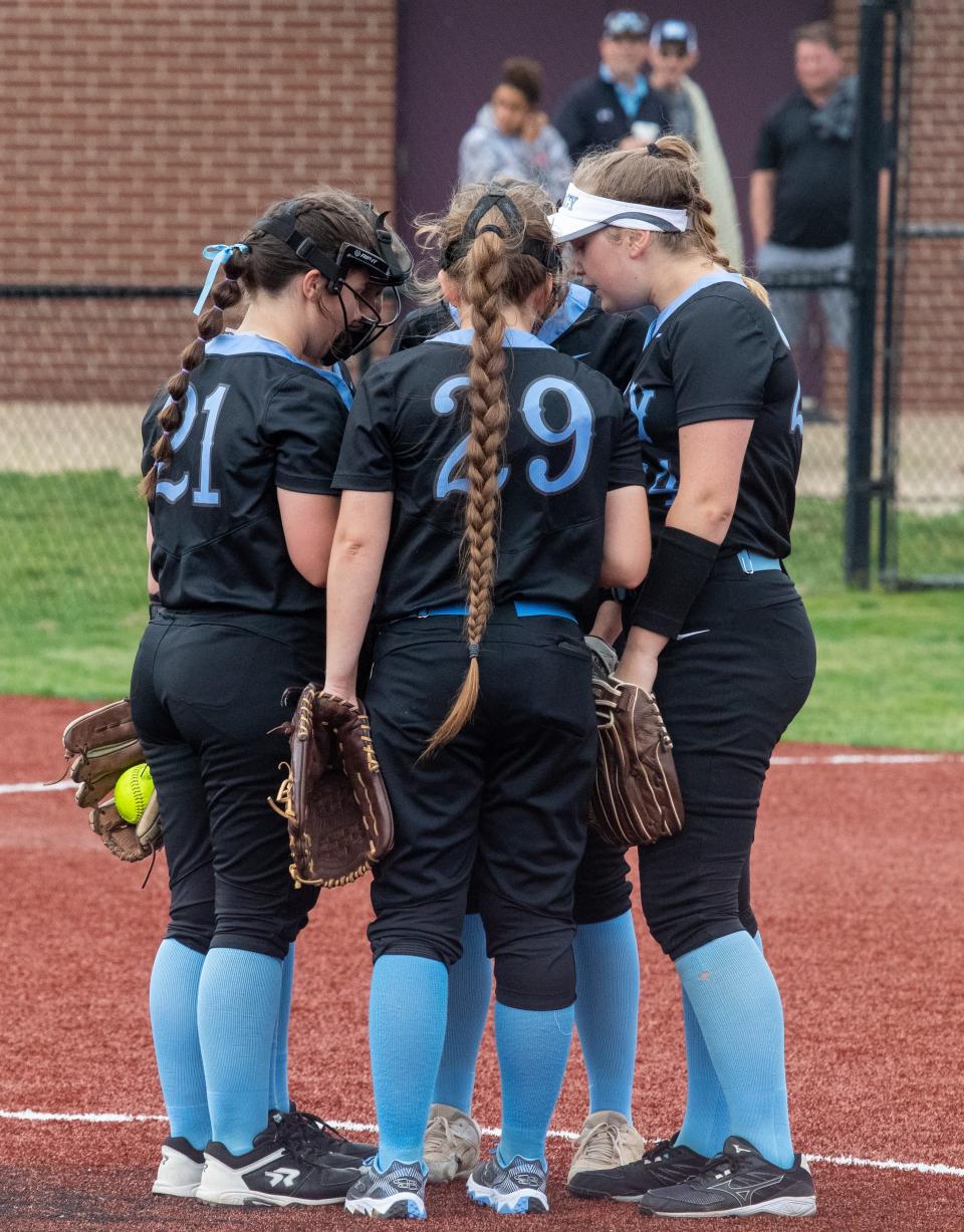 Mercy Academy teammates huddle Tuesday night against Assumption High School. Assumption won the game 10-0 after an early offensive explosion. April 12, 2022
