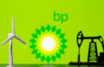 FILE PHOTO: A 3D printed windmill and oil pump jack are seen in front of displayed BP (British Petroleum) logo in this illustration picture