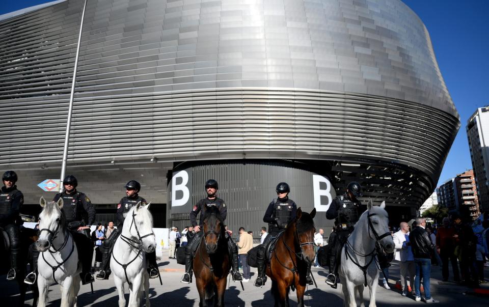 Police on horses are seen outside the stadium in Madrid