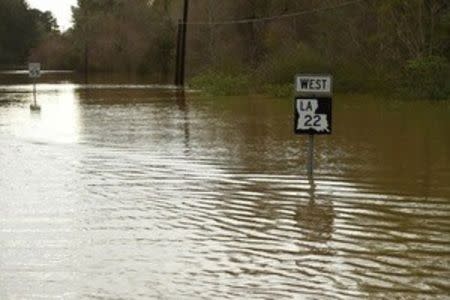 Floodwaters cover Route 22 in this picture released by the U.S. Air National Guard photo in Ponchatoula, Louisiana taken March 12, 2016. REUTERS/U.S. Air National Guard/ Master Sgt. Toby M. Valadie/Handout via Reuters