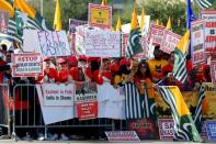 Counter-demonstrators protest during a "Howdy, Modi" rally celebrating India's Prime Minister Narenda Modi at NRG Stadium in Houston