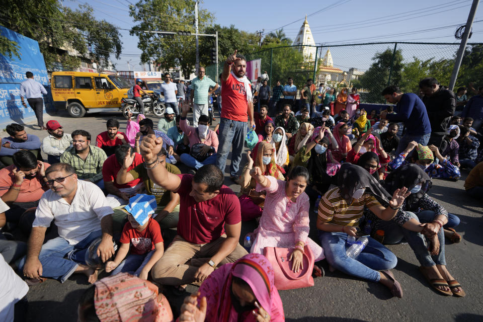 Kashmiri Hindus shout slogans against the killing of Puran Krishan Bhat, shot dead at his home in Shopian, during a protest in Jammu, India, Saturday, India, Oct. 15, 2022. Assailants have fatally shot the Kashmiri Hindu man in violence police blamed on militants fighting against Indian rule in the disputed region. (AP Photo/Channi Anand)