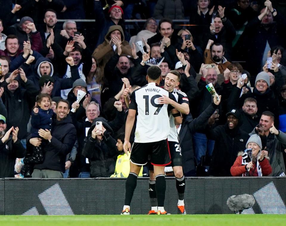 Timothy Castagne celebrates with Rodrigo Muniz (PA)