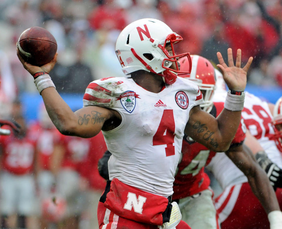 Jan 1, 2014; Jacksonville, FL, USA; Nebraska Cornhuskers quarterback Tommy Armstrong Jr. (4) throws the ball during the second half against the Georgia Bulldogs at EverBank Field . Mandatory Credit: Melina Vastola-USA TODAY Sports