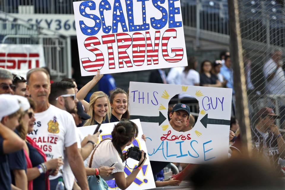 FILE - Supporters of House Majority Whip Steve Scalise, R-La., hold signs before the Congressional baseball game, June 15, 2017, in Washington. This week's confrontation that ended with FBI agents fatally shooting a 74-year-old Utah man who threatened to assassinate President Joe Biden was just the latest example of how violent rhetoric has created a more perilous political environment across the U.S.(AP Photo/Alex Brandon, File)