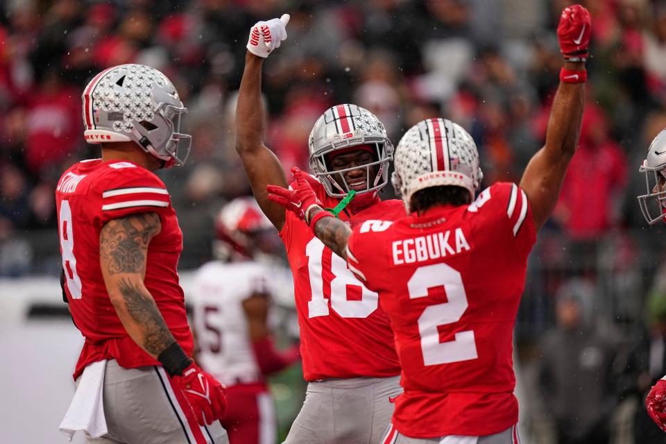 Nov 12, 2022; Columbus, Ohio, USA;  Ohio State Buckeyes wide receiver Emeka Egbuka (2) celebrates a touchdown by wide receiver Marvin Harrison Jr. (18) during the first half of the NCAA football game against the Indiana Hoosiers at Ohio Stadium. Mandatory Credit: Adam Cairns-The Columbus Dispatch