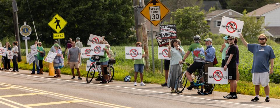 Protesters line Main St. just outside of Allentown where developers are proposing to build a warehouse and pave over a Revolutionary War site.