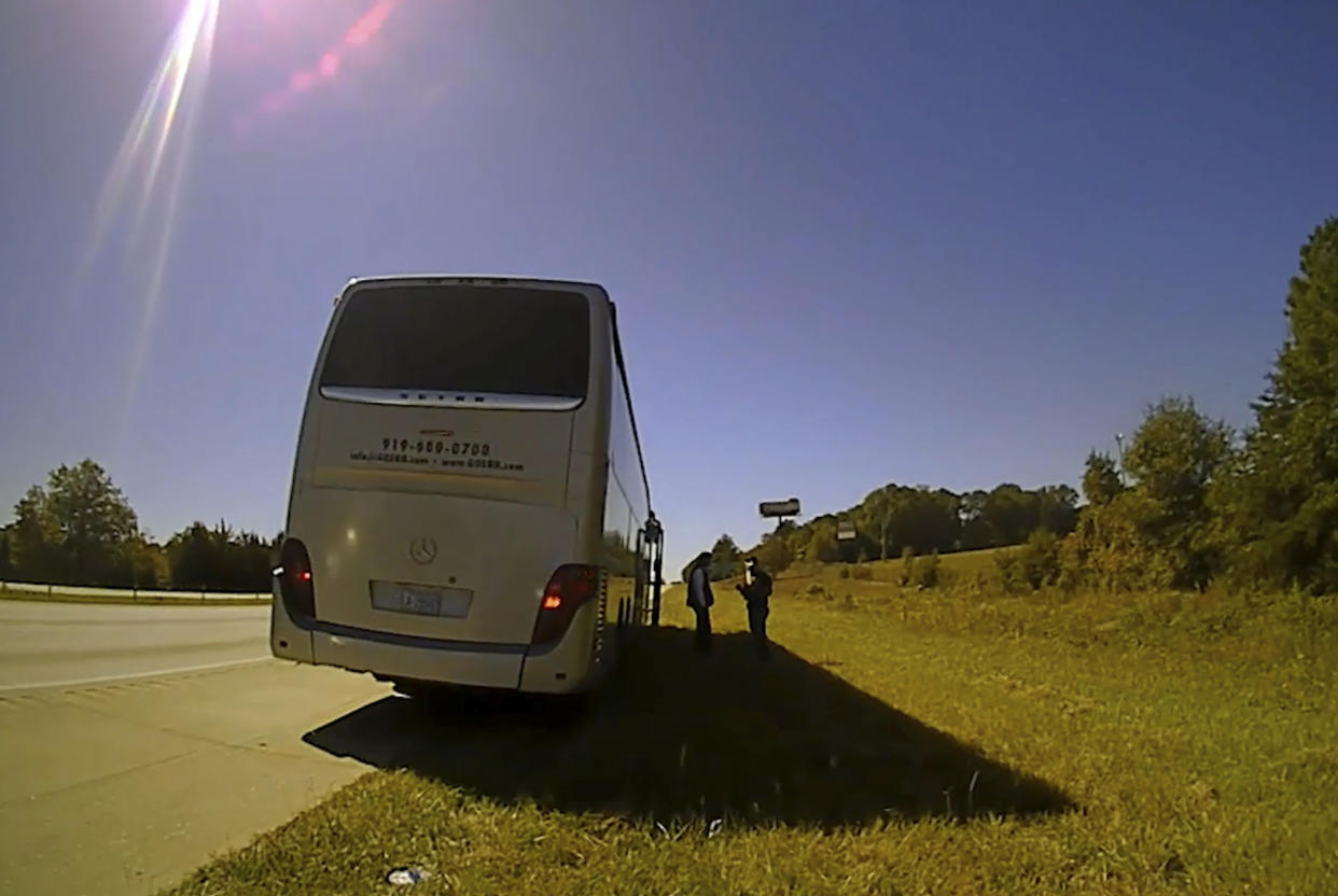 In this screenshot of a video released by Spartanburg County Sheriff’s Office, law enforcement officers stop a contracted bus in Spartanburg County, S.C., transporting students from Shaw University, an HBCU in Raleigh, N.C., to a conference in Atlanta on Oct. 5, 2022. (Spartanburg County Sheriff’s Office via AP)