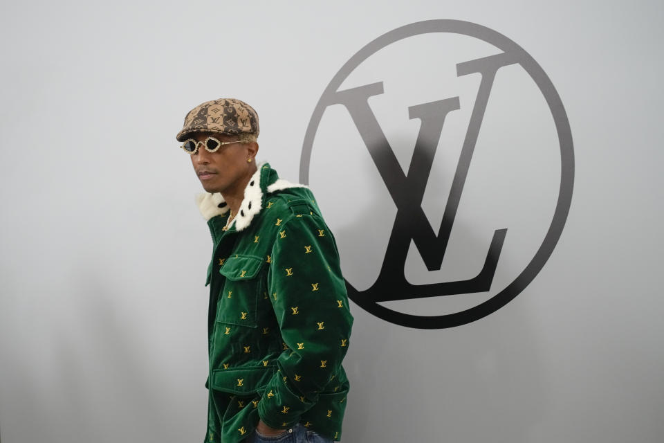 FILE - Pharrell Williams attends the Louis Vuitton Fall/Winter 2023-2024 ready-to-wear collection presented, March 6, 2023 in Paris. The signs of hip-hop’s influence are now everywhere from Pharrell Williams becoming Louis Vuitton’s men’s creative director to billion-dollar brands like Dr. Dre’s Beats headphones and retail mainstays like Diddy’s Sean John and the Rocawear line started by Jay-Z. It didn’t start out that way. Companies at first balked at partnering with hip-hop acts because they felt that the genre that appealed to Black and brown teens and young adults didn't align with their brands (AP Photo/Christophe Ena, file)