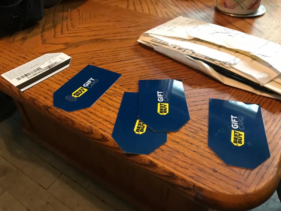 Scammers told Tracy Taschereau to put money on Best Buy gift cards after they deposited fake checks into her account to make it seem like she had money and could qualify for a loan. She read off the numbers on the phone, enabling scammers to have quick access to the cash.