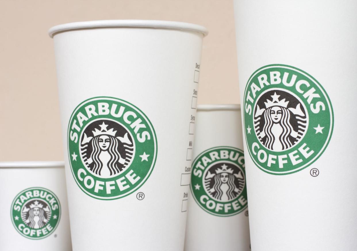 Budapest, Hungary - November 9, 2011: Starbucks Paper Coffee Cups in a row.