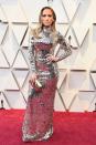 <p>We bow down to this <a href="https://www.harpersbazaar.com/celebrity/red-carpet-dresses/a23119249/jennifer-lopez-oscars-kim-kardashian-met-gala/" rel="nofollow noopener" target="_blank" data-ylk="slk:disco ball of a human;elm:context_link;itc:0;sec:content-canvas" class="link ">disco ball of a human</a>, in a metallic embroidered mirror mosaic long-sleeved gown by Tom Ford. It's all glamour for the most glam night of the year.</p>