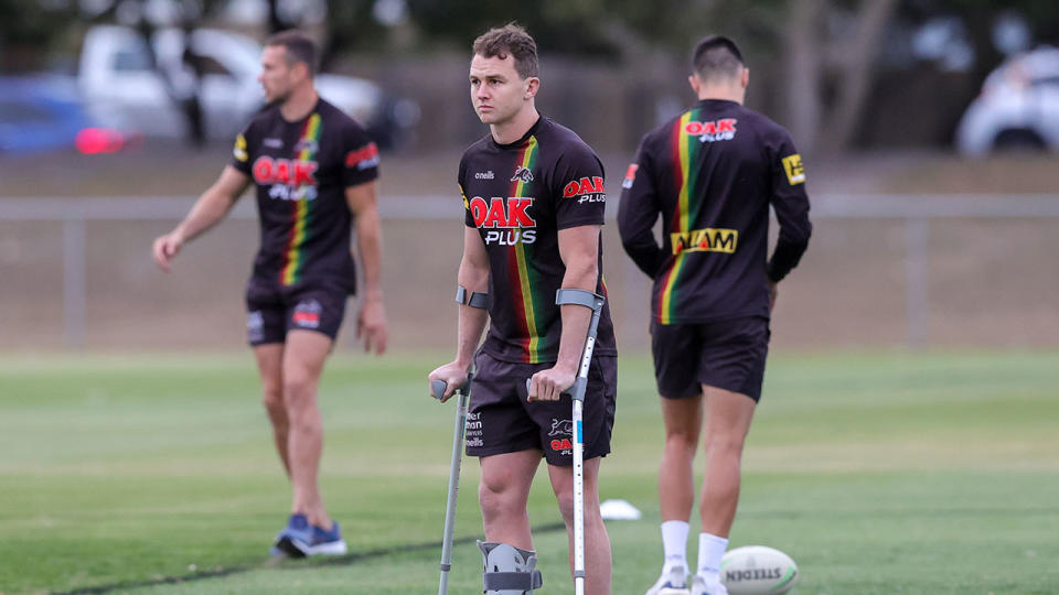 Pictured here, Dylan Edwards on crutches in the lead-up to Sunday night's NRL grand final.
